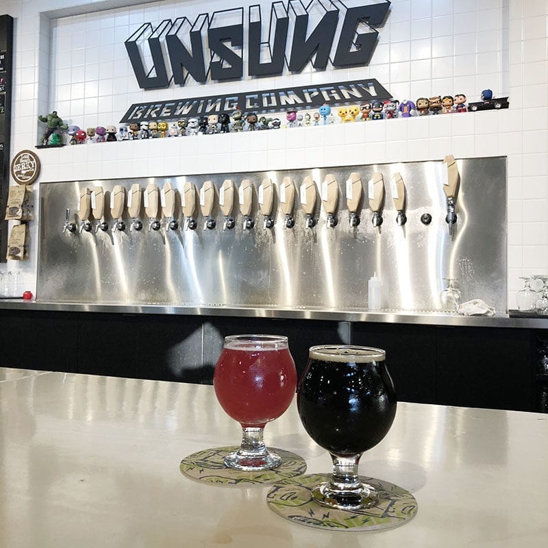 Two samples at Unsung Brewing: Struberry, a tart strawberry/blueberry mix, and the Exit Light Stout, part of the brewery's "incubator" series.