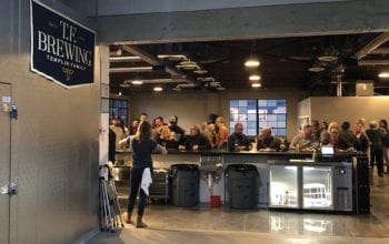 Looking out toward the taproom from the brewhouse, the two areas connect seamlessly.