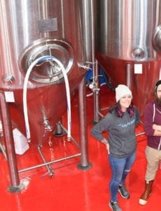 Roosters Brewing Co.'s Head Brewer Jacquie King, left, and Brewery Engineer Colton Layton.