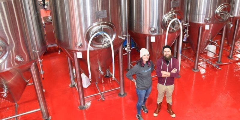 Roosters Brewing Co.'s Head Brewer Jacquie King, left, and Brewery Engineer Colton Layton.