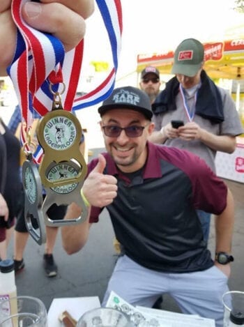 Chaz Smith picks up some hardware at the 5th Annual Lagerpalooza homebrew competition on May 5, 2019. He earned Best of Show honors at the just-completed 2020 competition.