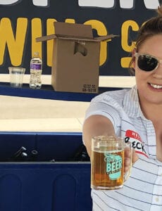 Rebecca Cardaccio, sales director for Proper Brewing Co. in Salt Lake City, serves a beer at the Utah Beer Festival in 2019.